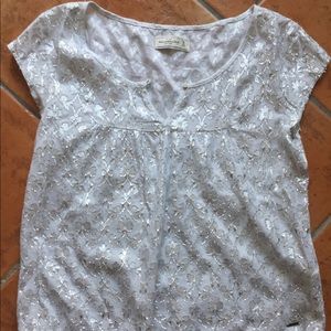 Silver/metallic thread top.